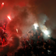 Illustration for article titled Smoke, Flares, Riot Police In Belgrade Derby Make For Haunting Photos